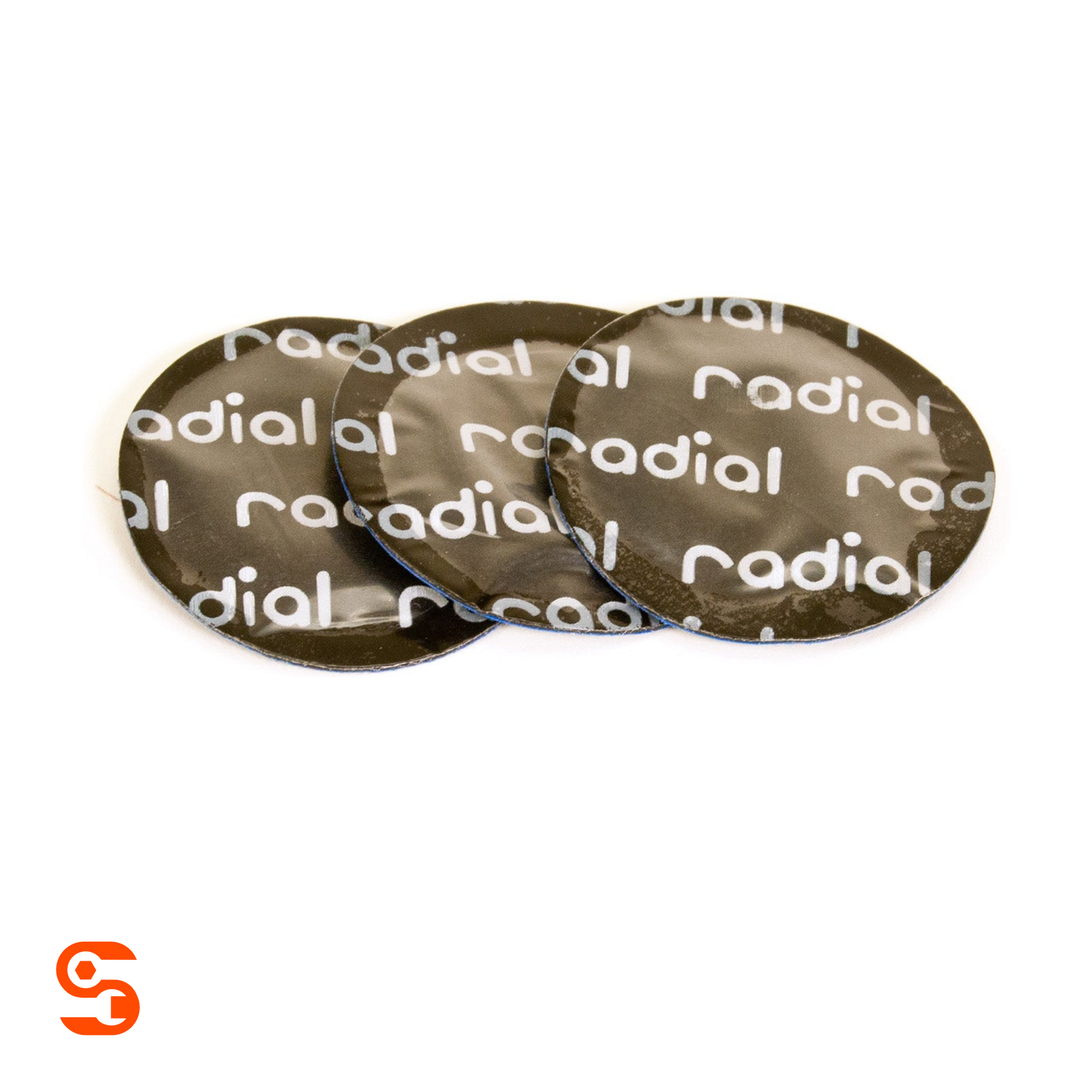 Three small round black wheel repair patches with white Radial branding on a white background