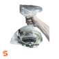 Clear polyethylene automotive part return bag holding a used part, shown with a hand gripping the top