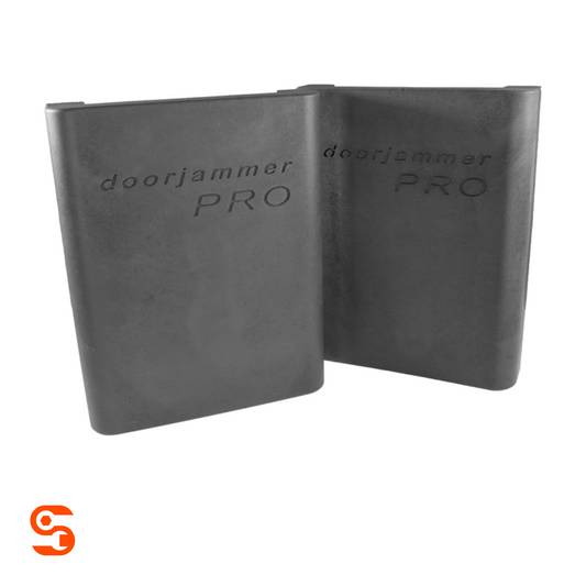 Pair of black DoorJammer Pro car door protectors with embossed logos on a white background