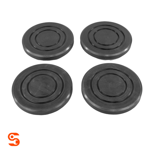 Set of four black rubber arm pads with concentric circular grooves for vehicle lifts