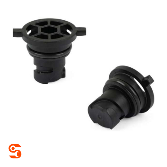 Two black plastic drain plugs for Nissan Rogue with round slotted tops and rubber sealing rings
