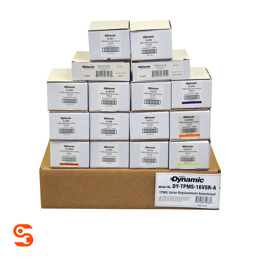OEM TPMS valve stem assortment with labeled white parts boxes stacked on a brown shipping box