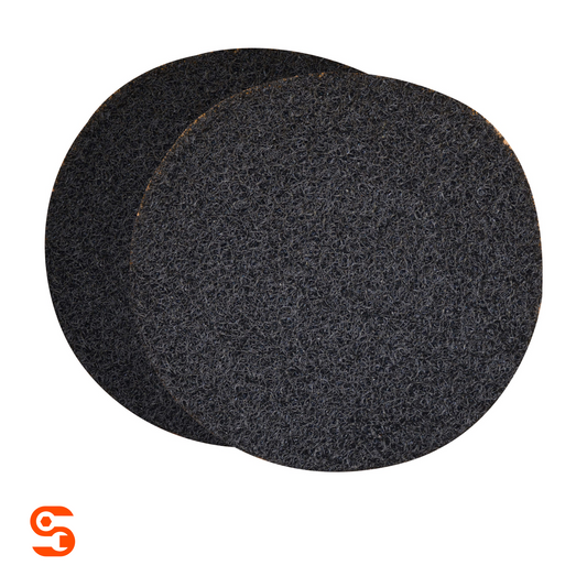 Two round black textured oil drain splash pads with overlapping edges on a white background