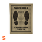 Tan disposable paper floor mat with black shoe prints, grid design, and service message, box of 500